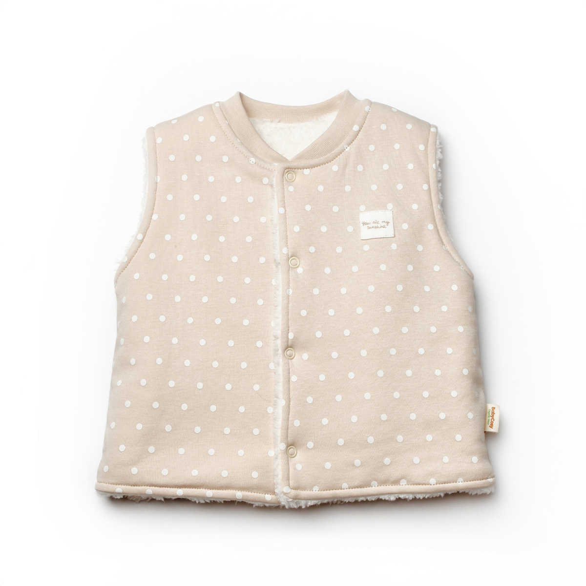 Vestă bebeluși crem cu buline albe – bumbac moale și călduros Vestă bebeluși crem cu buline albe, din bumbac moale și călduros, îmbrăcăminte practică și confortabilă pentru copii